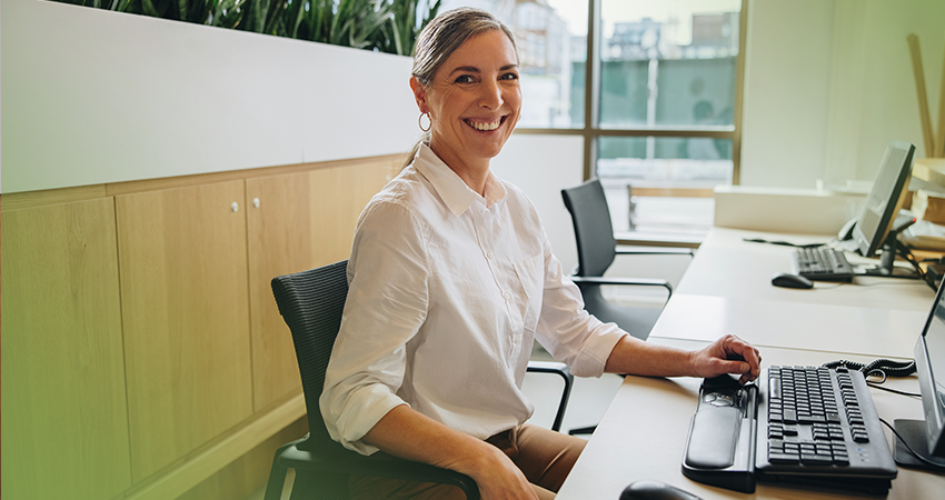 Healthcare biller sitting at a computer