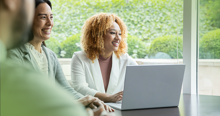 healthcare leaders in a meeting referencing RCM analytics