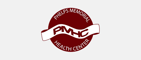 Logo of Phelps Memorial Health Center, featuring a maroon circle with the text Phelps Memorial Health Center around the edge and PMHC on a white ribbon across the center, symbolizing excellence throughout every stage of the healthcare revenue cycle.