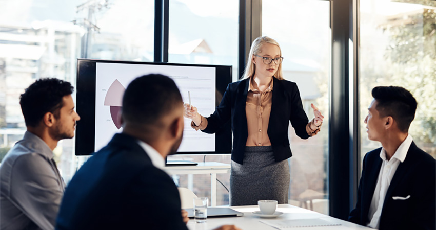 A woman gives a presentation during a meeting.