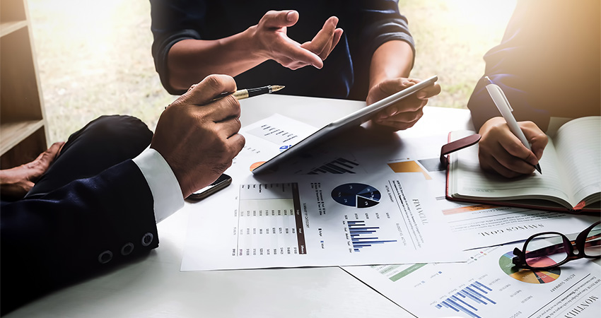 healthcare providers looking over data on commercial claims denials