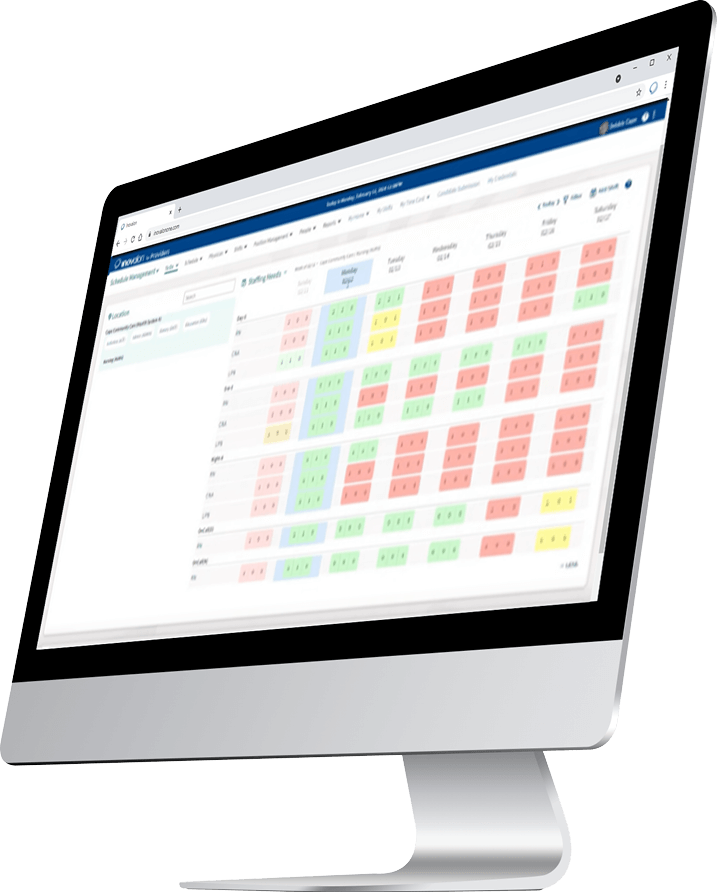 A computer monitor displays a spreadsheet with rows and columns filled with colored cells in green, red, and blue, indicating various data statuses on a web-based interface for quality improvement solutions.