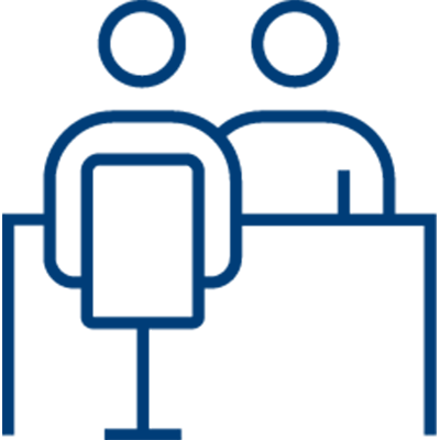 Simple blue line drawing showing two people sitting at a table, with one person facing forward in a chair and the other beside or behind them, illustrating a conversation about capturing patient payments.