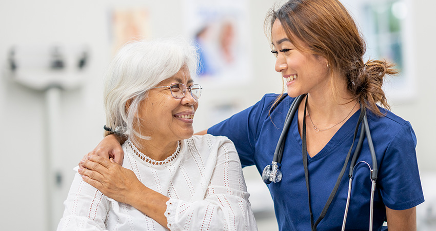 Nurse caring for patient smiling