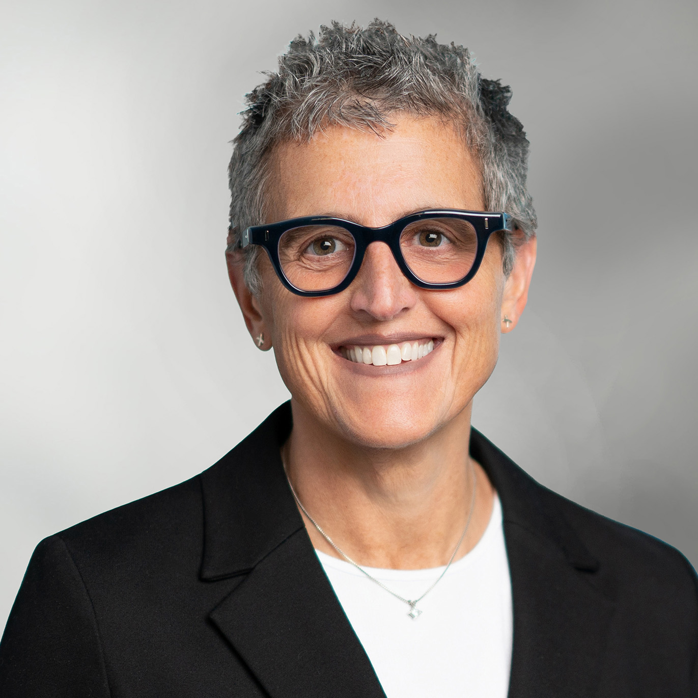 Melanie Margolin leadership headshot - woman with short, grey hair and glasses