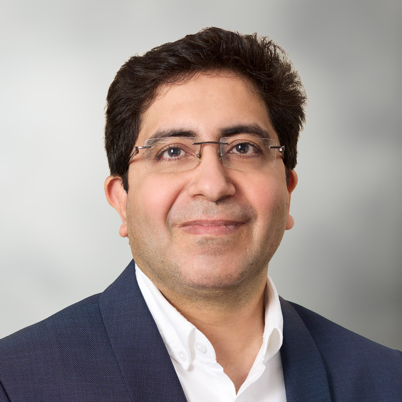 Vikas Sahni leadership headshot - man with dark hair and glasses