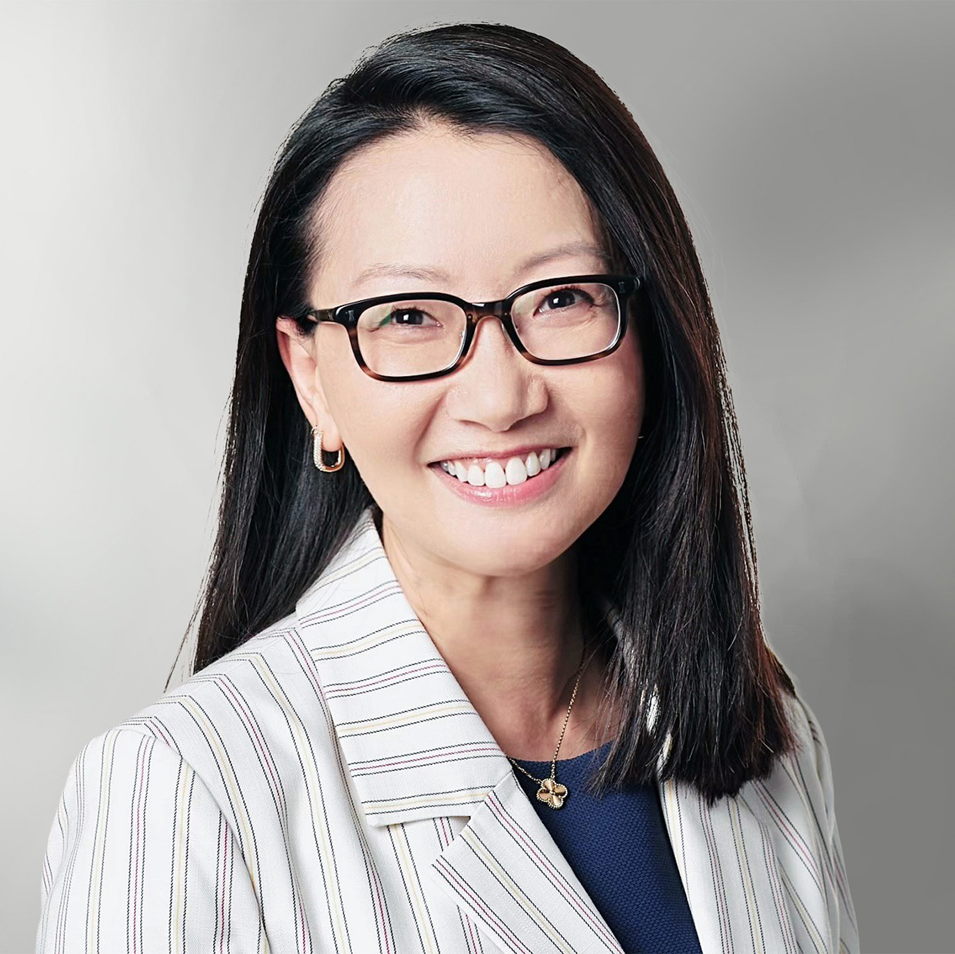 Xiaodan Zhang leadership headshot - woman with dark, medium-length hair and glasses