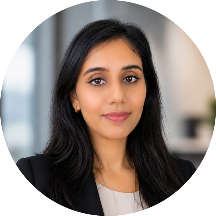 Deepa Dongarwar headshot - woman with dark mid-length hair soft smiling for headshot