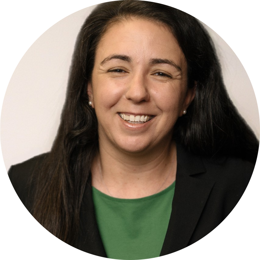 Gabrielle F. Miller headshot - woman with dark mid-length hair smiling for headshot in a black blazer