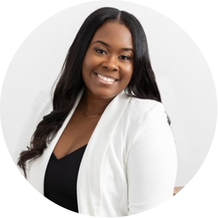 Jennifer Cordell headshot - woman in a white blazer with long black hair smiling at camera